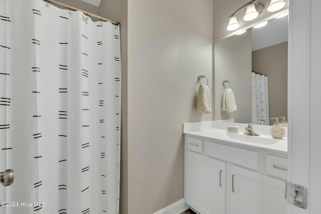 bathroom with vanity and walk in shower