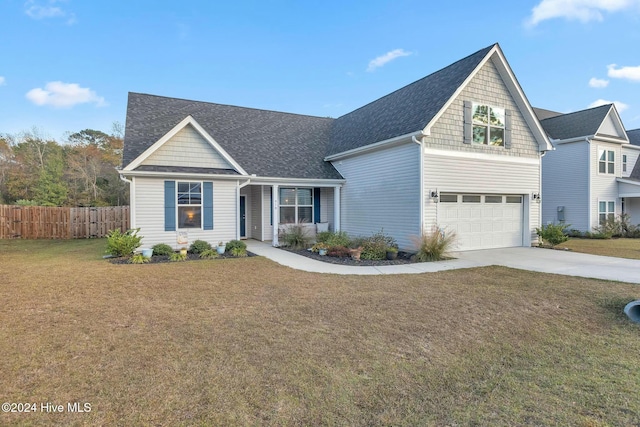 view of front of home with a garage and a front yard