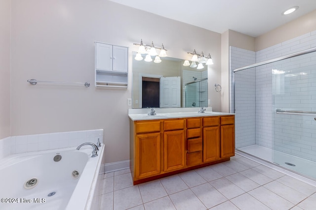 bathroom with vanity, tile patterned floors, and separate shower and tub