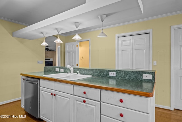 kitchen with crown molding, sink, wood-type flooring, white cabinetry, and hanging light fixtures