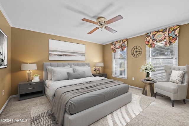 bedroom featuring ceiling fan, light colored carpet, and ornamental molding