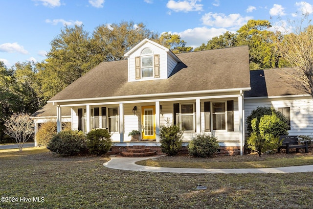 cape cod home featuring a porch