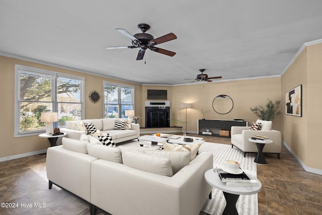 living room featuring ceiling fan and crown molding