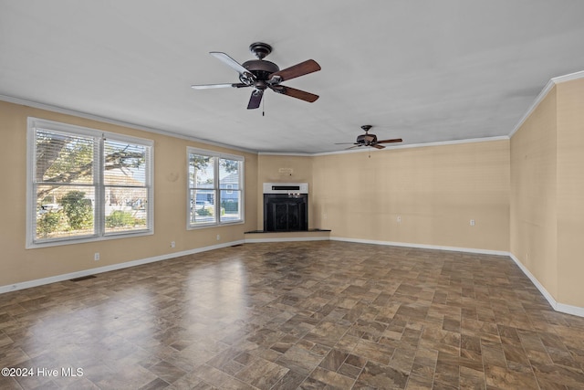 unfurnished living room featuring ceiling fan and crown molding