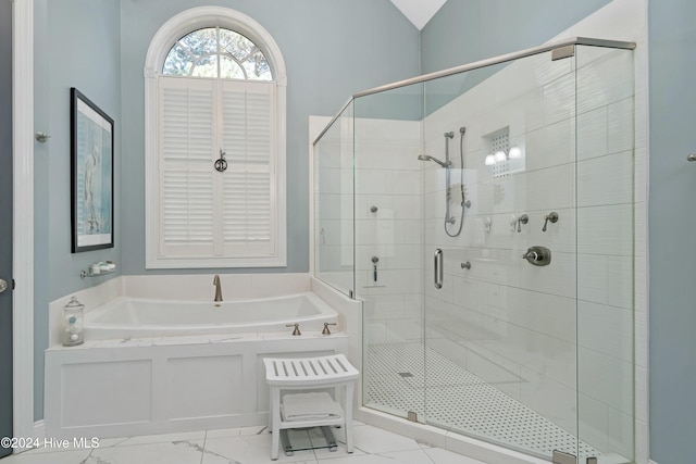 bathroom featuring shower with separate bathtub and lofted ceiling