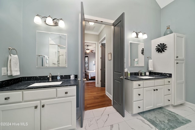 bathroom with vanity, hardwood / wood-style flooring, ceiling fan, and ornamental molding