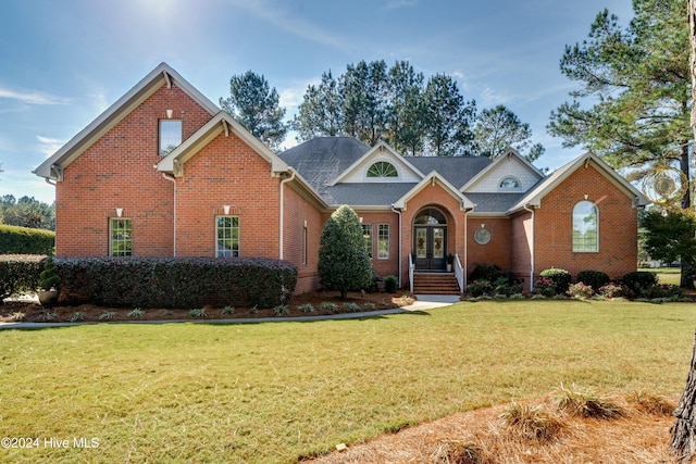 view of front property featuring a front yard and french doors