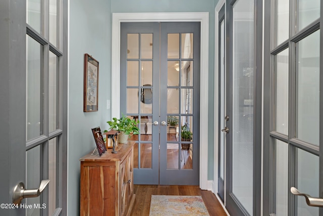 entryway with french doors and dark hardwood / wood-style floors