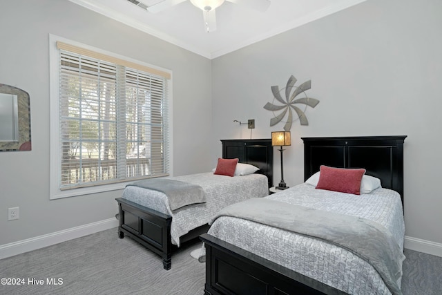 bedroom with light colored carpet, ceiling fan, and ornamental molding