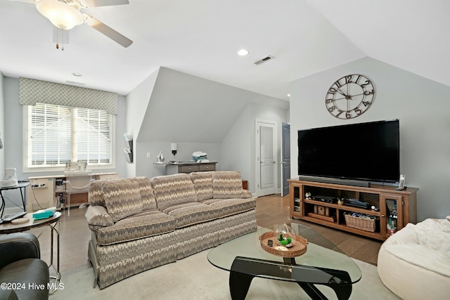 living room with ceiling fan, wood-type flooring, and vaulted ceiling