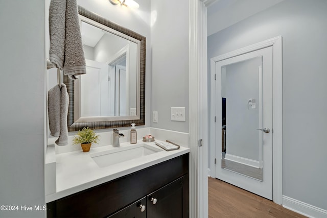 bathroom featuring hardwood / wood-style floors and vanity