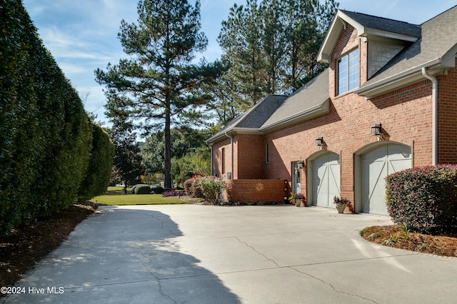 view of side of property with a garage