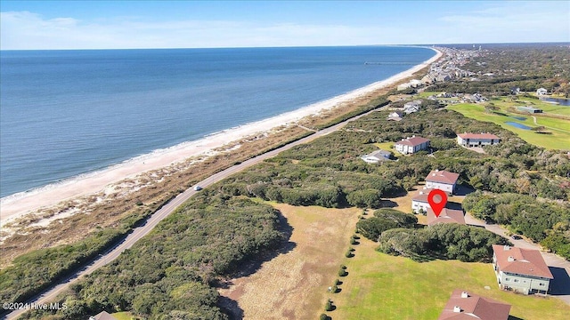 drone / aerial view with a water view and a view of the beach