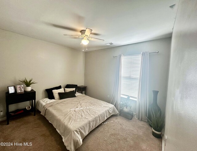 carpeted bedroom featuring ceiling fan