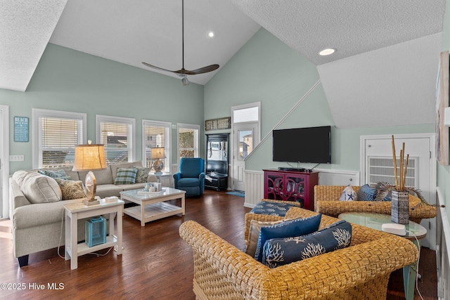 living room featuring a textured ceiling, ceiling fan, high vaulted ceiling, and dark hardwood / wood-style floors