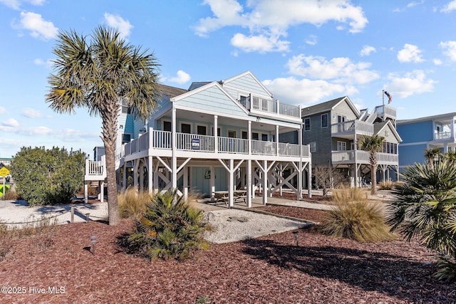 rear view of property featuring a balcony