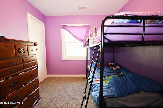 bedroom featuring light colored carpet