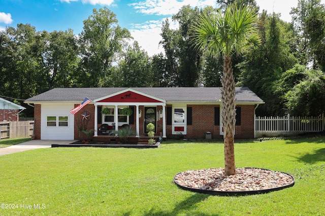 view of front of house with covered porch, central AC, and a front lawn