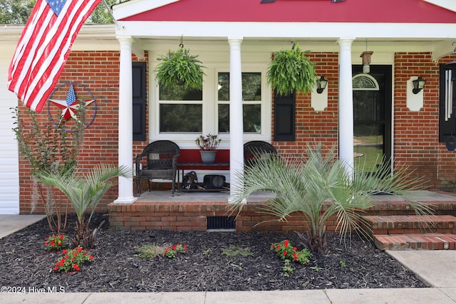 doorway to property with covered porch