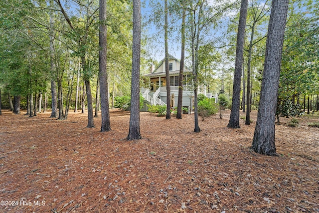 exterior space with a porch and stairway