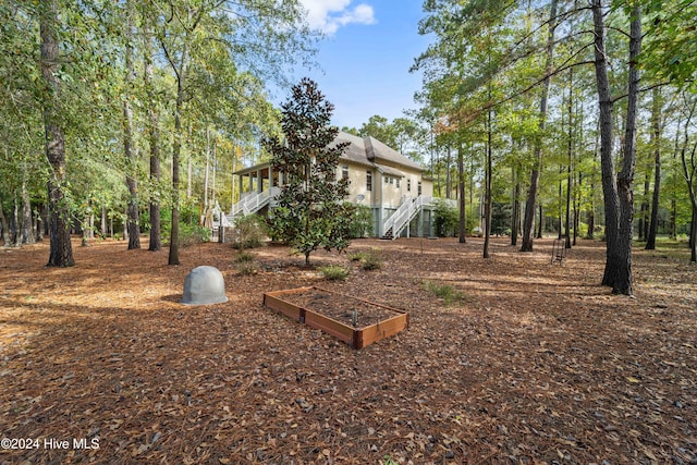 view of yard featuring stairs