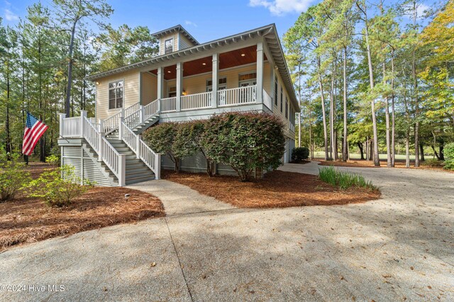 view of property featuring covered porch