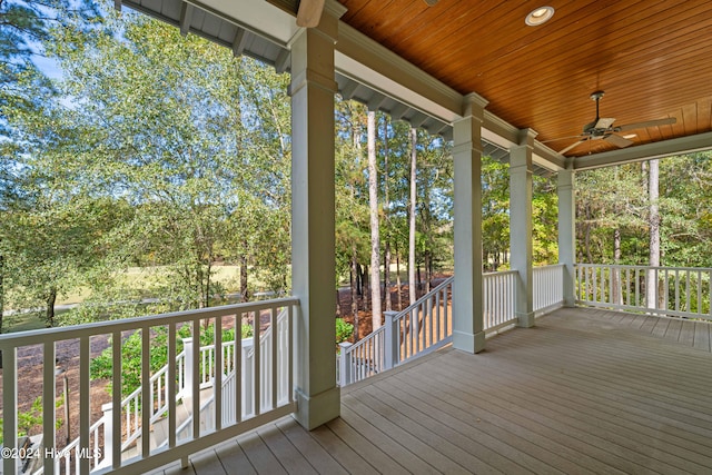 wooden deck with ceiling fan and a porch