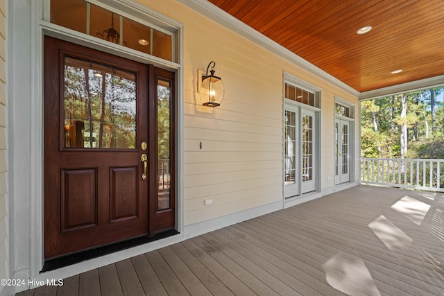 property entrance featuring french doors and a porch