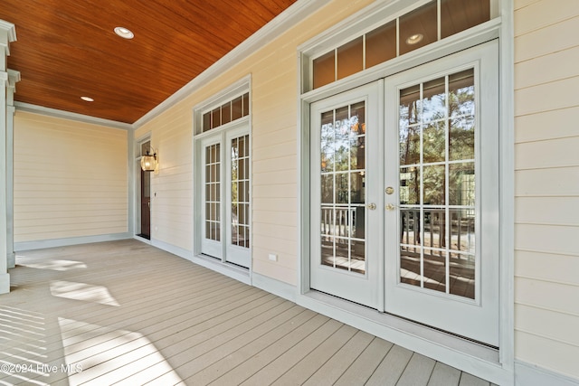 deck with french doors and a porch