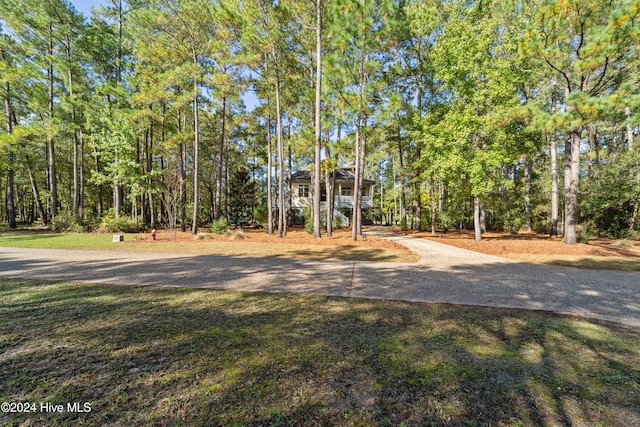 exterior space with a wooded view