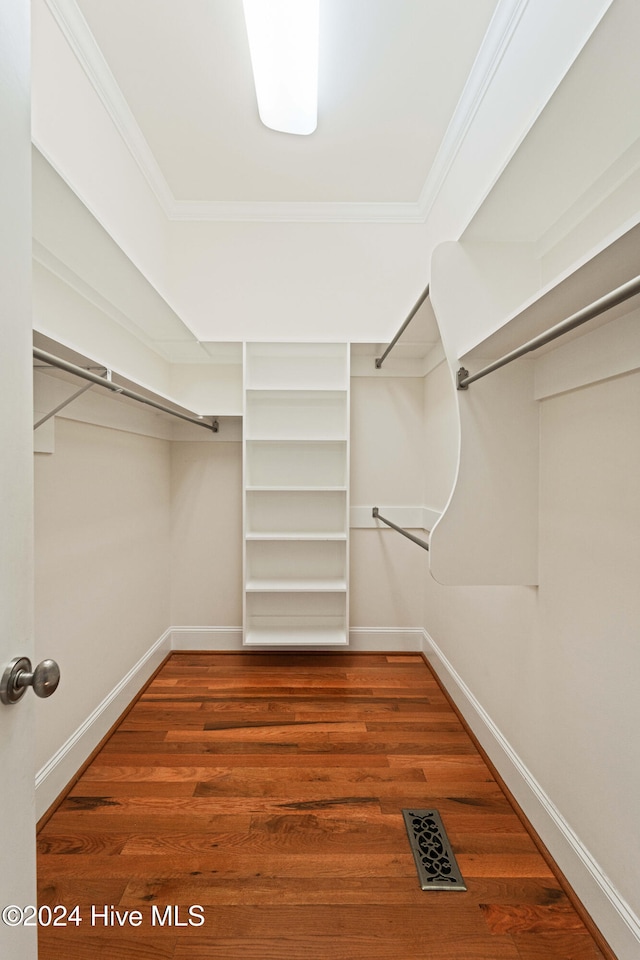 walk in closet featuring wood finished floors and visible vents