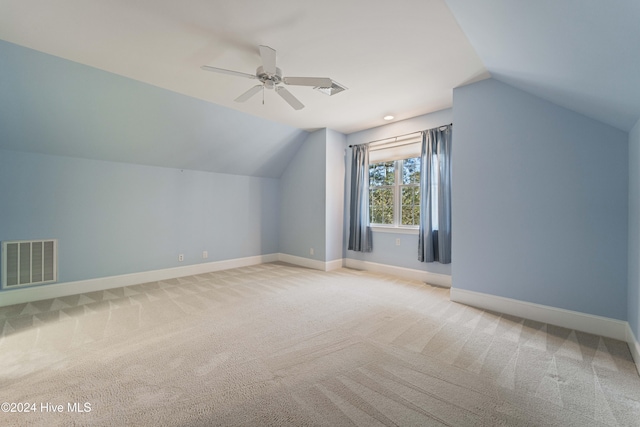 bonus room featuring vaulted ceiling, carpet floors, visible vents, and baseboards