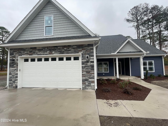 craftsman house with a garage