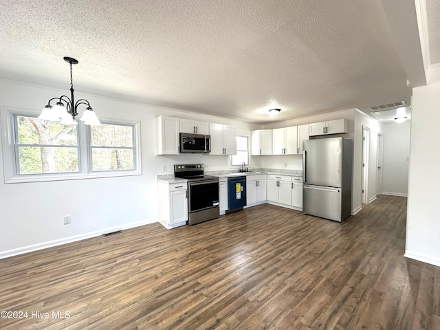 kitchen featuring white cabinetry, dark hardwood / wood-style floors, a chandelier, pendant lighting, and appliances with stainless steel finishes