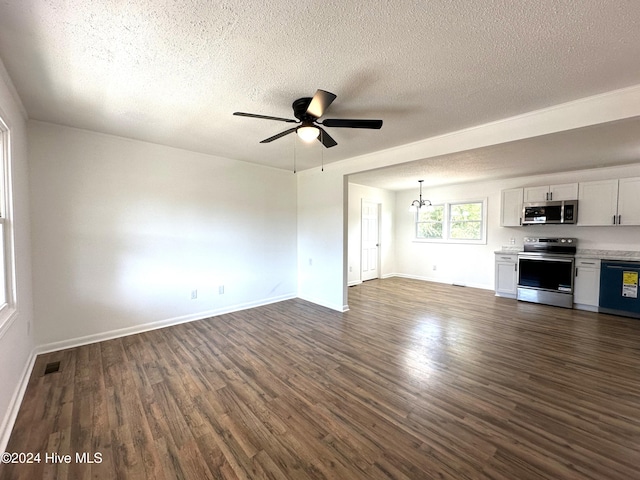 unfurnished living room featuring dark hardwood / wood-style flooring, ceiling fan with notable chandelier, and a textured ceiling