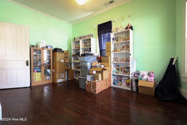 misc room featuring crown molding and dark wood-type flooring