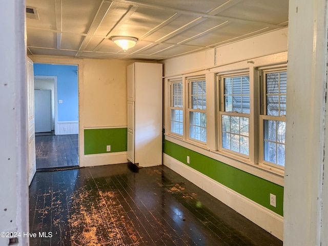 empty room featuring dark wood-type flooring