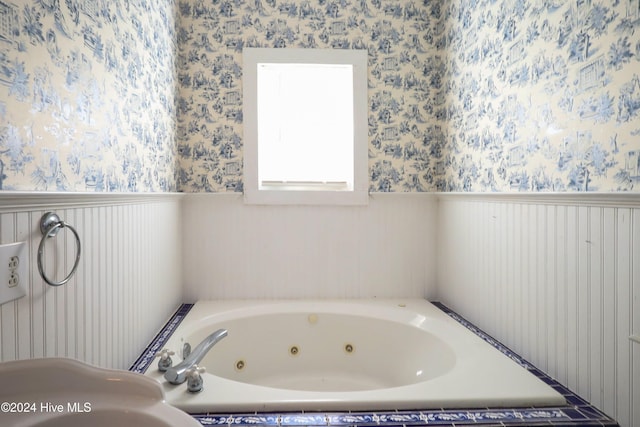 bathroom with a tub to relax in