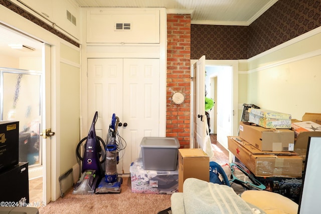 interior space featuring light carpet and crown molding