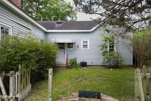 view of property exterior with a lawn