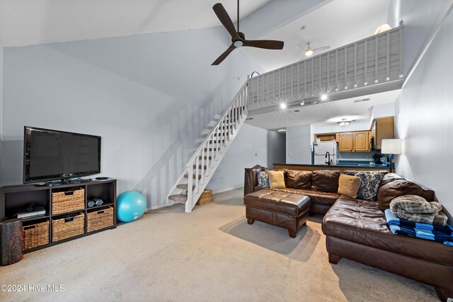 unfurnished sunroom featuring ceiling fan and a water view