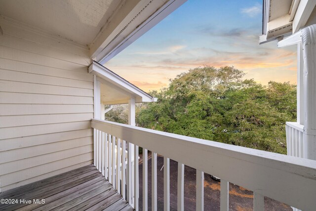 view of balcony at dusk