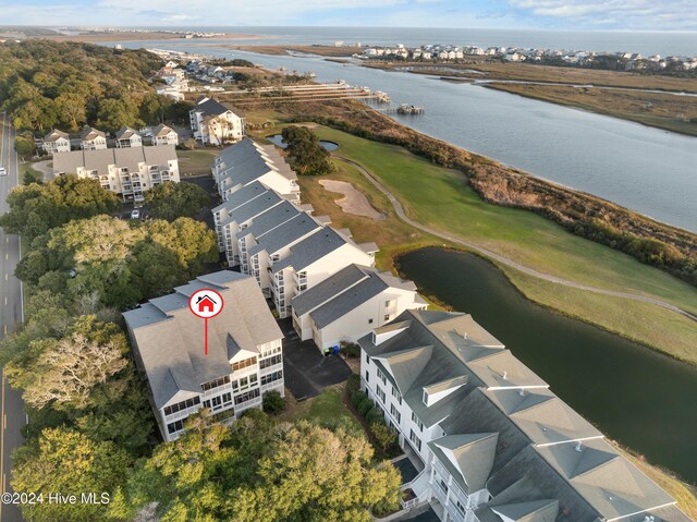 birds eye view of property with a water view