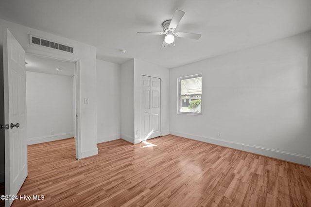 unfurnished bedroom with light wood-type flooring and ceiling fan