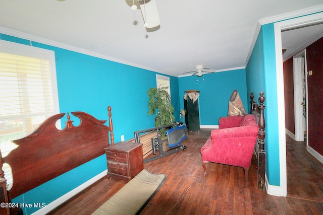 bedroom with ceiling fan, ornamental molding, and dark wood-type flooring