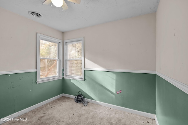 carpeted empty room with ceiling fan