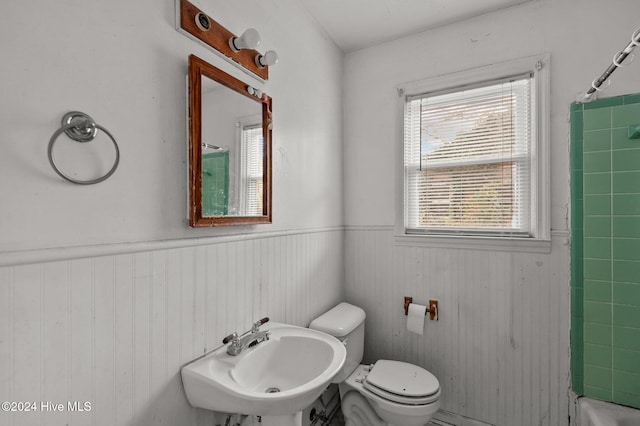 full bathroom featuring shower / bathtub combination, toilet, and sink