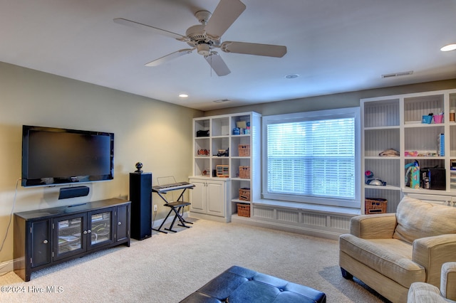 living room with carpet flooring, radiator heating unit, and ceiling fan