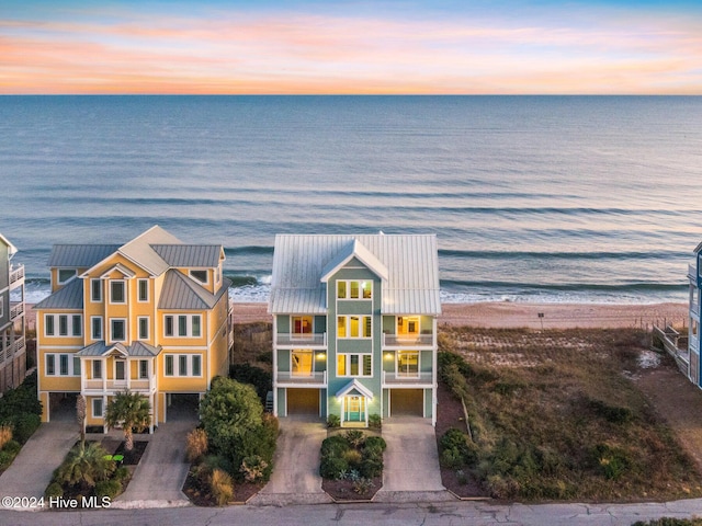 aerial view at dusk with a water view