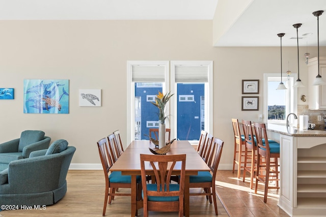 dining area with light hardwood / wood-style flooring